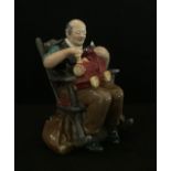 A Royal Doulton Bone China Figurine ' The Toymaker'