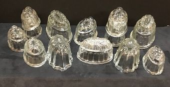 An assortment of vintage glass jelly moulds