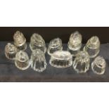 An assortment of vintage glass jelly moulds