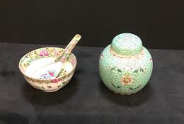 An oriental bowl & spoon and a lidded ginger jar