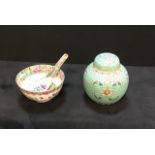 An oriental bowl & spoon and a lidded ginger jar