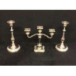 A silver plated heavy candelabra with a pair of silver plated candlesticks.