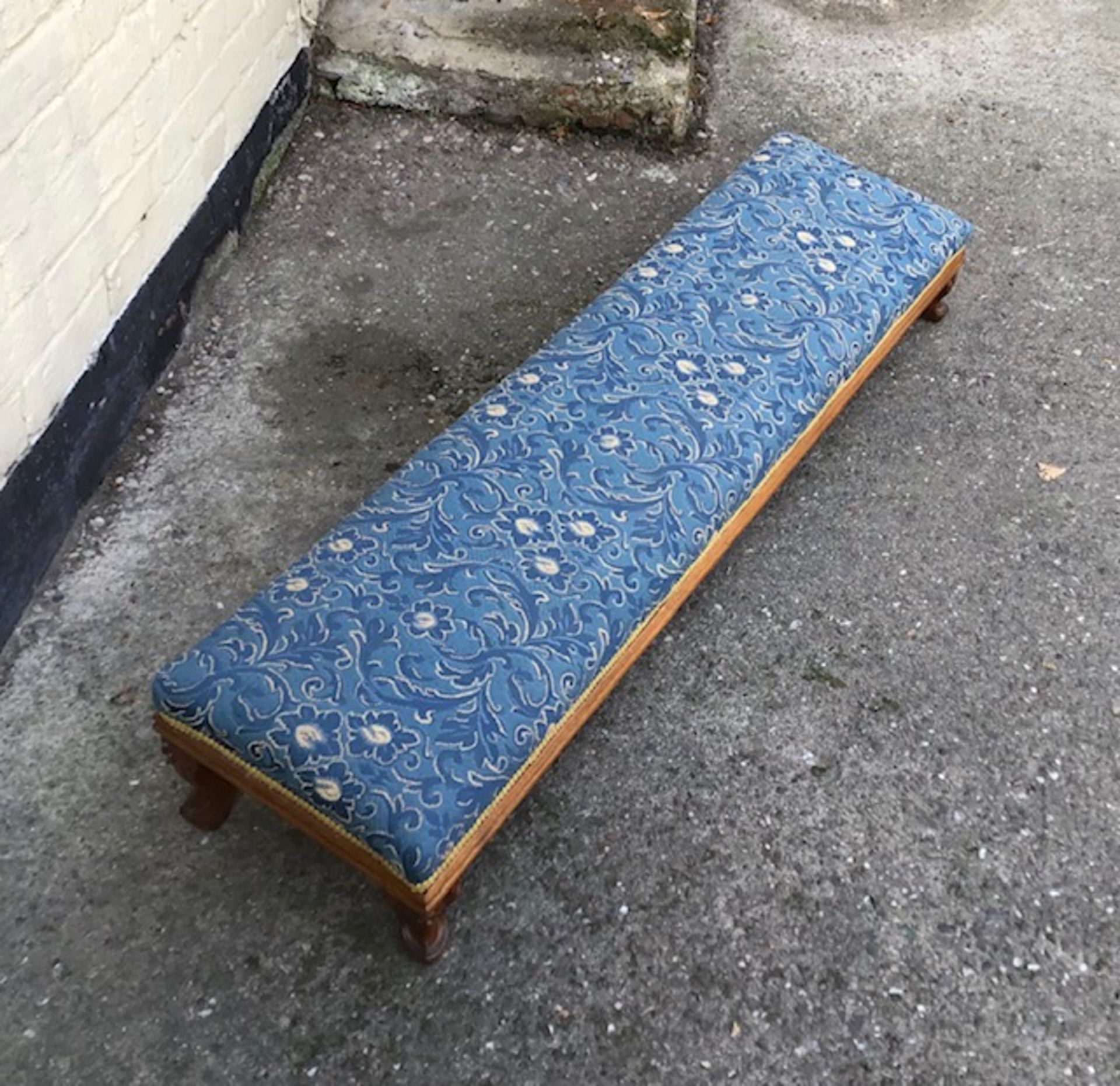 An antique double footstool.