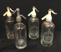 A collection of vintage soda syphons