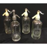 A collection of vintage soda syphons