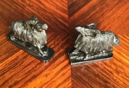 A pair of antique Derbyshire slate carved rams.