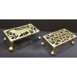 A pair of antique brass trivots