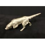 A Vintage cast white coloured metal hunting dog.