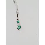 18ct hallmarked white gold emerald and diamond pendant