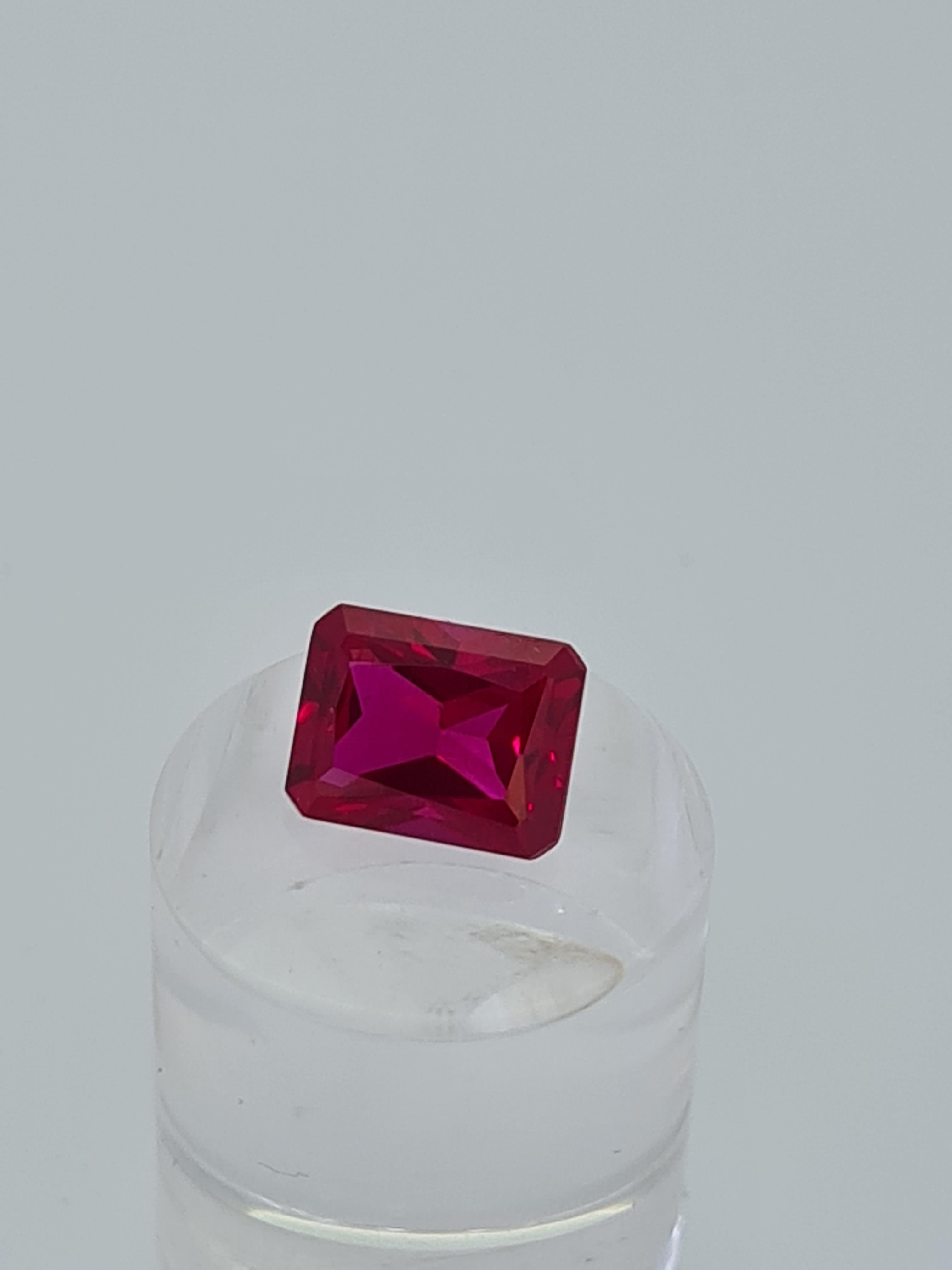 Synthetic ruby emerald cut stone