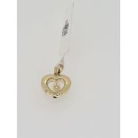 9ct yellow gold heart shaped floating diamond pendant