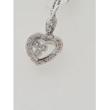 18ct hallmark white gold diamond set pendant