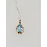 375 yellow gold pear cut topaz pendant