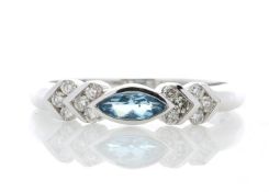 9k White Gold Diamond And Blue Topaz Ring