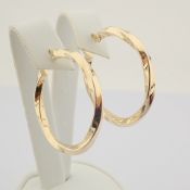 Earring. In 14K Yellow Gold