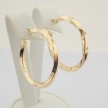 Earring. In 14K Yellow Gold