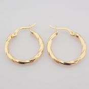 Earring. In 14K Yellow Gold