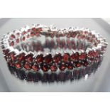 Silver bracelet with garnet