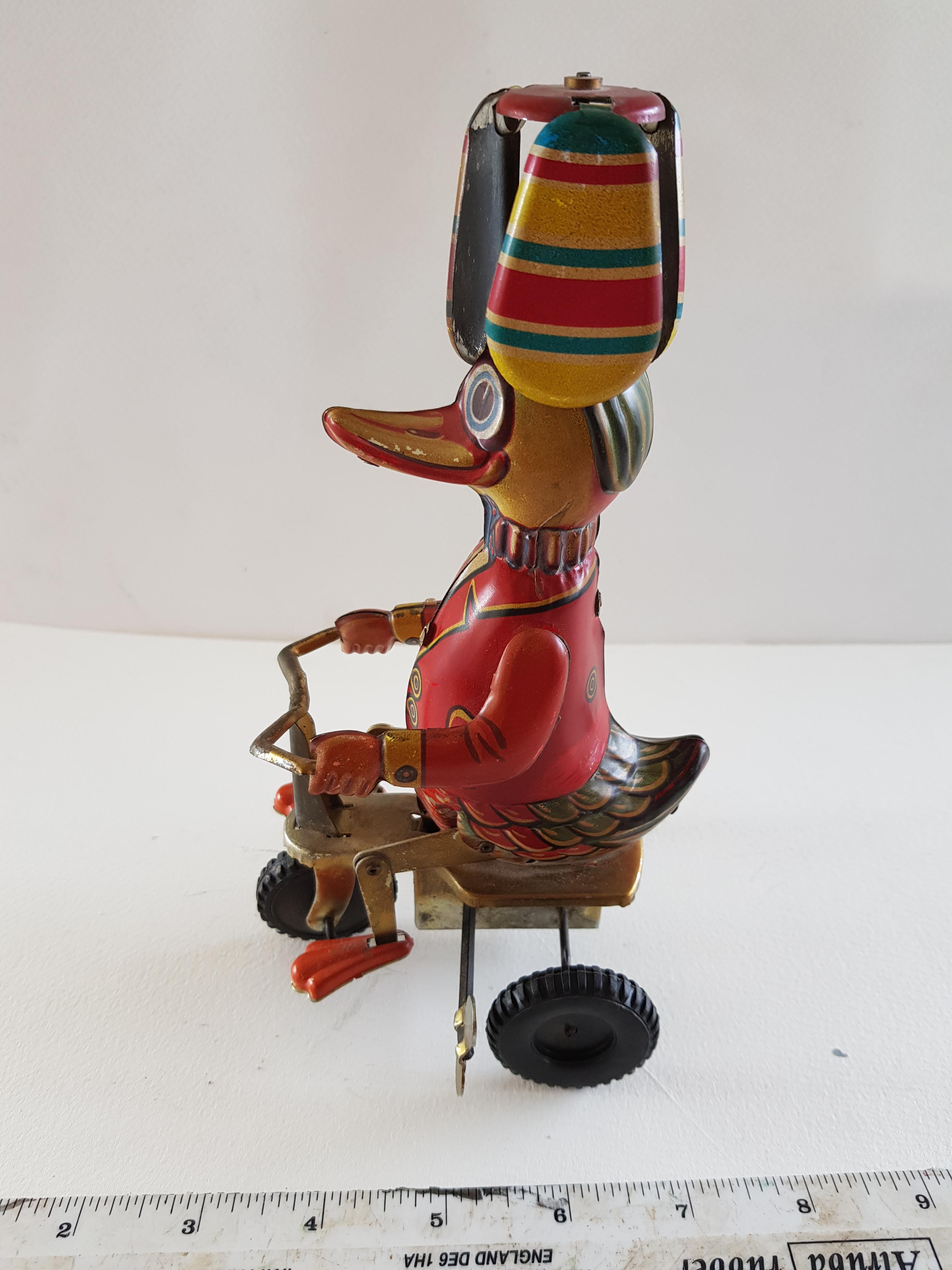 Vintage Tin Plate Wind Up Duck On a Bicycle