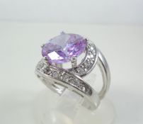 Silver ring with violet and white stones