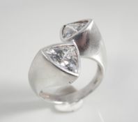 Silver ring with triangle white stones