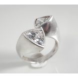 Silver ring with triangle white stones