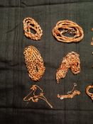 Yellow metal chains in various designs