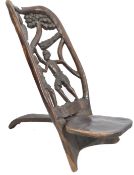 An African carved tribal birthing chair
