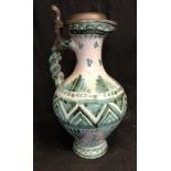 A faience pottery claret jug