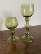 Two green wine goblets