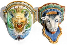 Two maiolica wall brackets