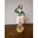 Staffordshire figure of a girl with a parrot