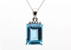 9ct White Gold Diamond And Blue Topaz Pendant