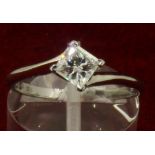 GIA Certified Platinum & 0.58ct Princess Cut Diamond E VVS1 Four Claw Twist Ring