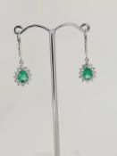 18ct whitegold emerald and diamond earrings