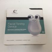 Compact facial toning device