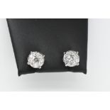 Pair of Round Diamond Earrings.