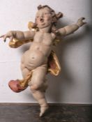 Holzfigur eines kleinen Engels/Putto (20. Jahrhundert), vollplastisch geschnitzt,polychrome Fassung,