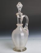 Glaskaraffe (um 1850/70), klares Glas, in Balusterform m. Spiraldekor, orig. Stöpsel, H.ca. 37,5 cm.