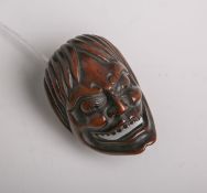 Holz-Netsuke (Provenienz wohl Japan, wohl 19. Jahrhundert), Maske, wohl sog. Men-Netsuke,wohl aus