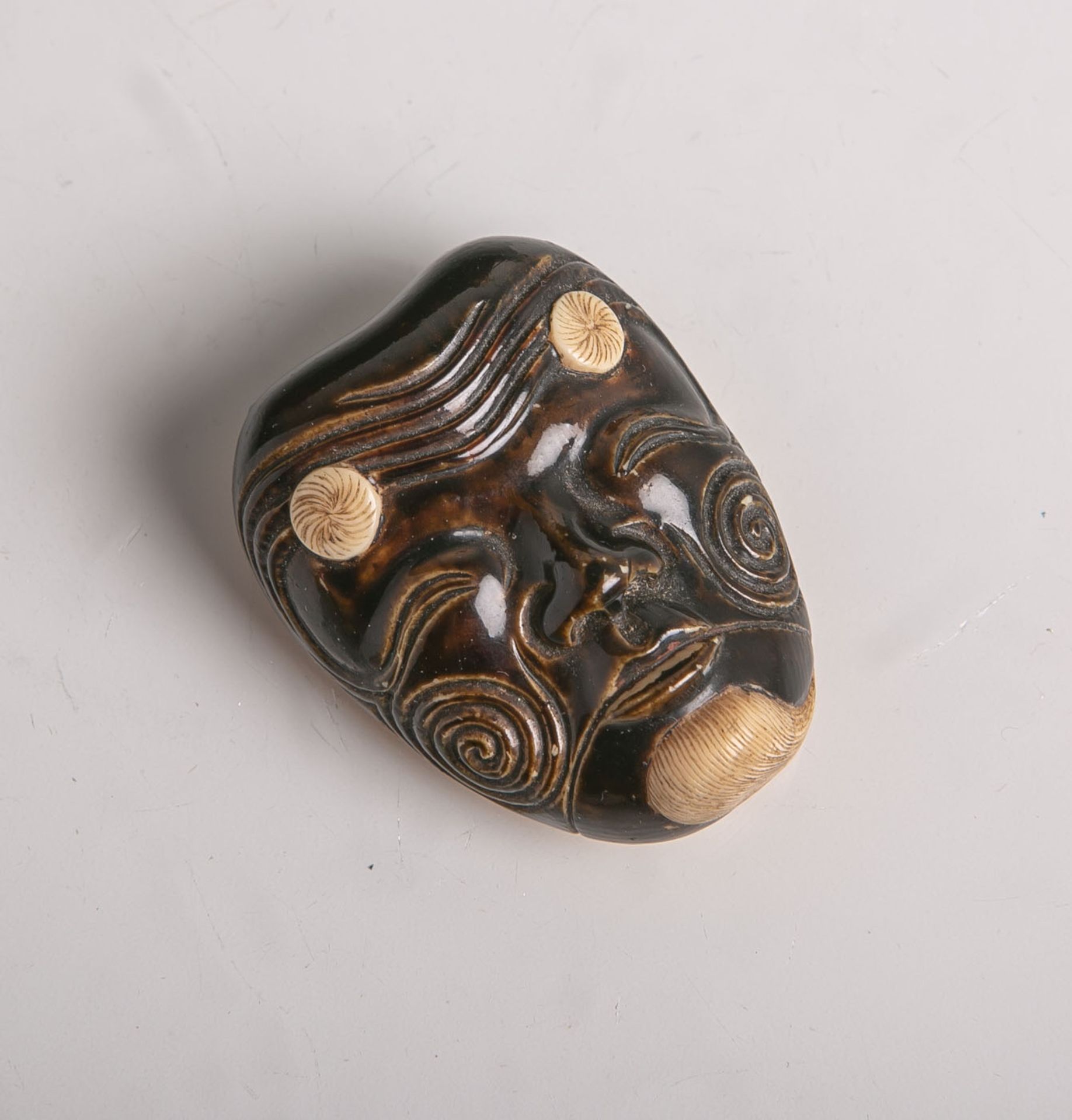 Elfenbein-Netsuke (Provenienz wohl Japan, Alter unbekannt), Maske, wohl sog. Men-Netsuke,wohl