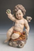 Holzfigur eines kl. Engels/Putto auf Wolken, vollplastisch geschnitzt, polychrome Fassung,teils