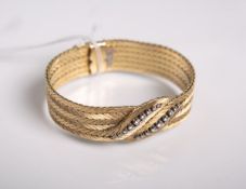 Elegantes Damenarmband 750 GG, mittig in Blattform gestaltet, besetzt m. 18 Brillanten von