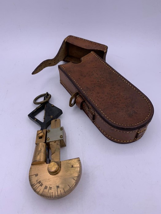 A De Lisle Pattern Handheld Pendulum Clinometer from the WW I period in a WWII case dated 1941