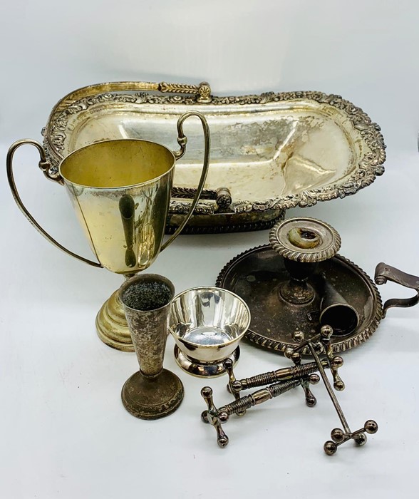 A selection of silver plated items to include a trophy and handled basket etc