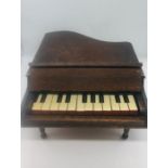 A miniature scratch built grand piano