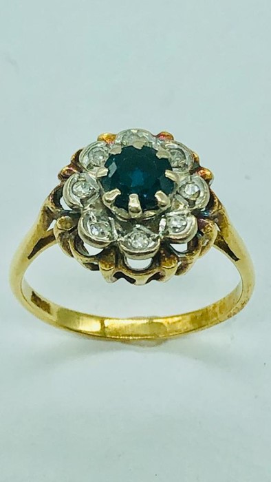 An 18ct yellow gold ring, centre claw set 5mm round sapphire with eight illusion set diamonds. - Image 8 of 10