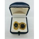 A pair of Gents 18ct gold and Agate cuff links with a single diamond to each, hallmarked and with