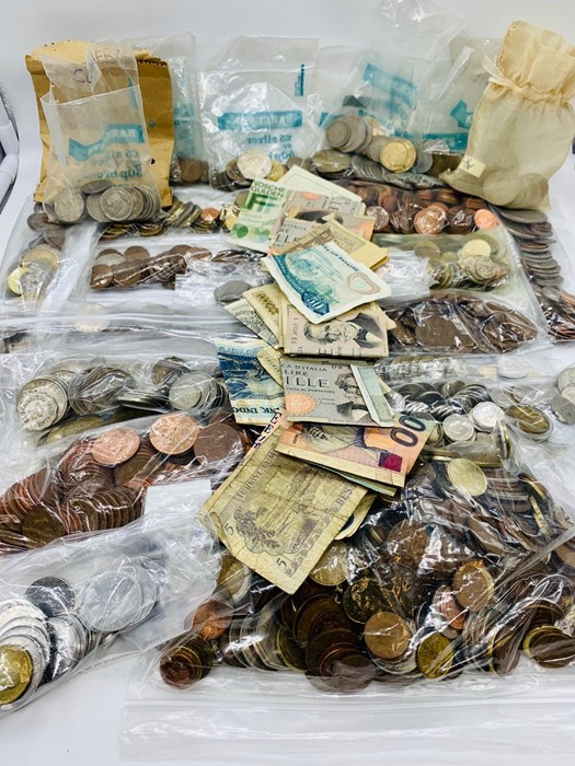 A Large Volume of coins, various countries, denominations and conditions.