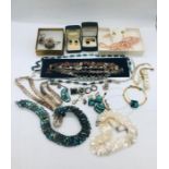 A quantity of jewellery to include several pieces of mother of pearl, shell and Murano